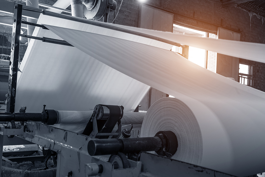 Image depicting the inside of a paper mill.