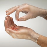 3.5 mil Industrial Grade Powder-Free 9.5" Vinyl Disposable Gloves, 100/Box thumbnail 1